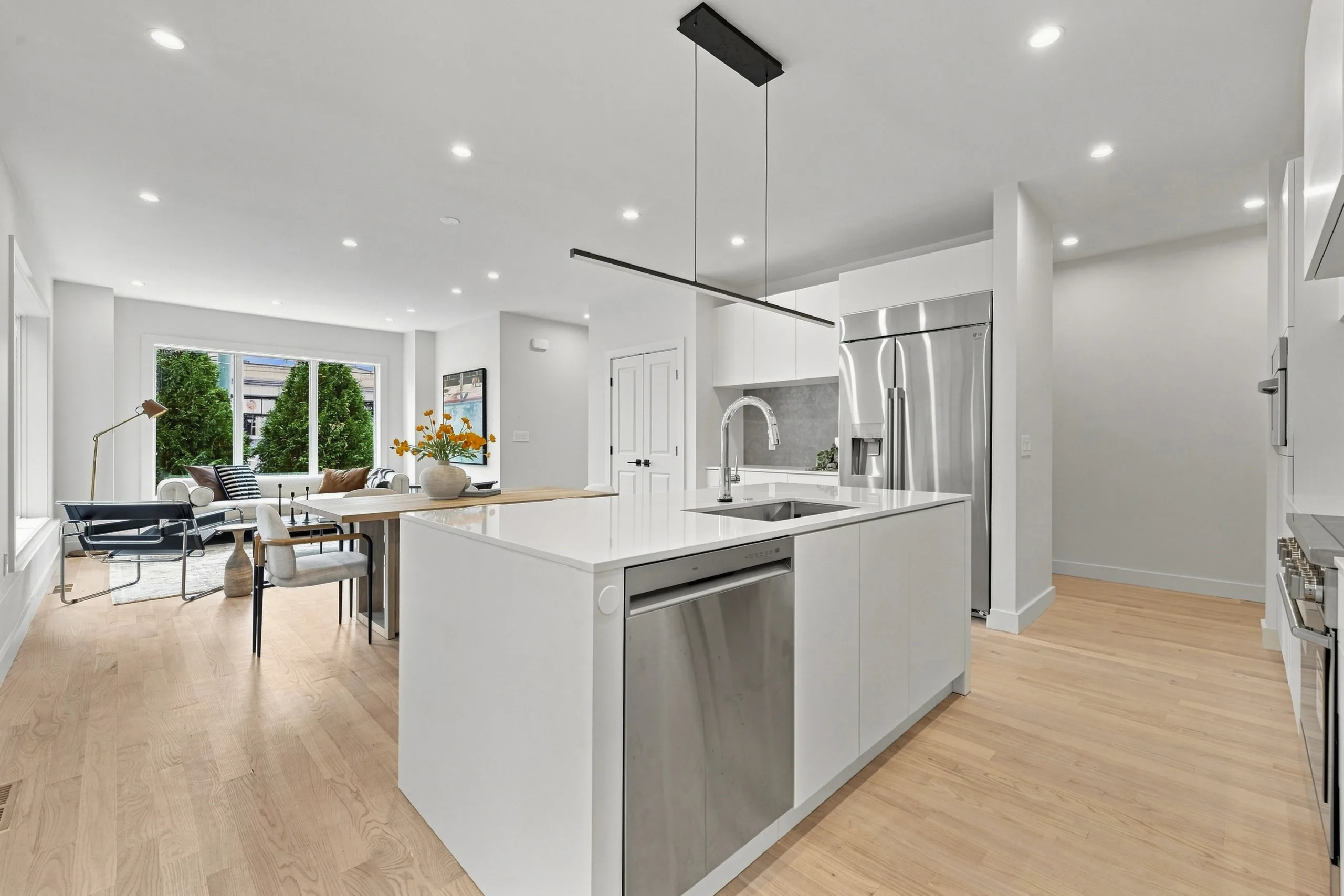 Open-concept kitchen with island and living area